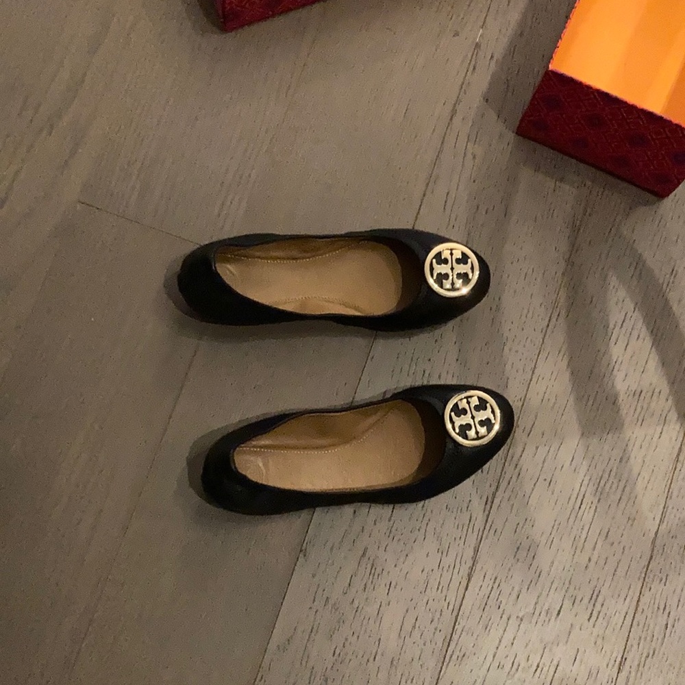 Tory Burch black ballet flat with gold logo.